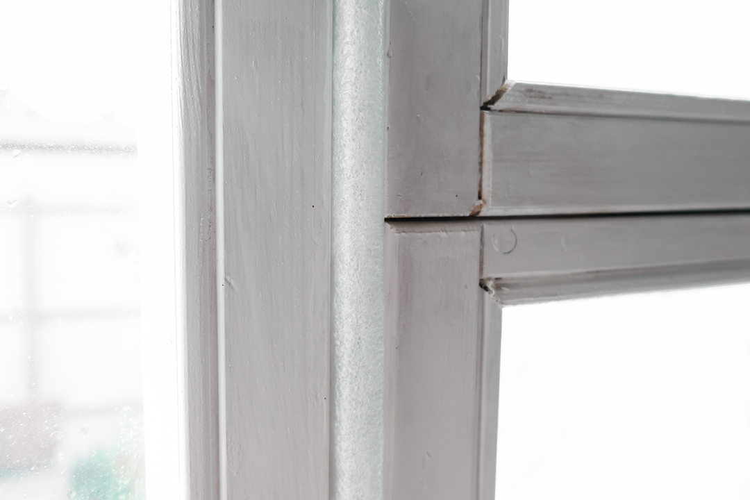 In addition to weather stripping, caulk, and insulation strips can also be used to seal any gaps or cracks around windows or doors.