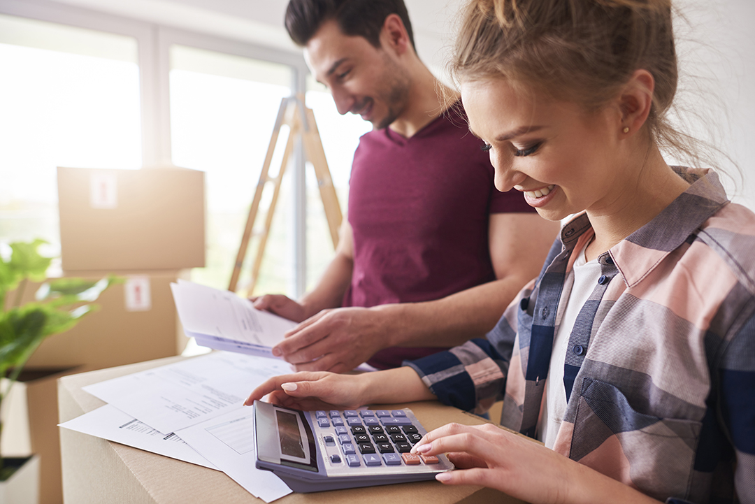 Happy couple planning their Budgeting for Basement Renovation