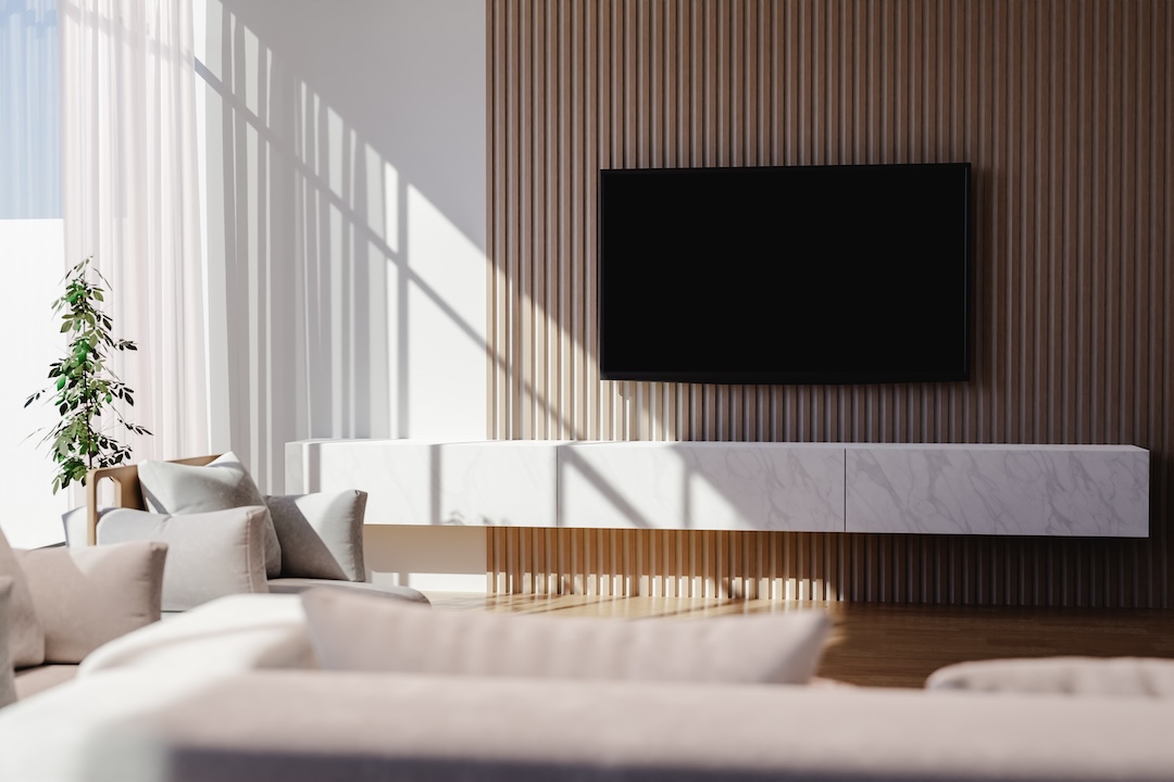 Modern TV area with wooden panels.